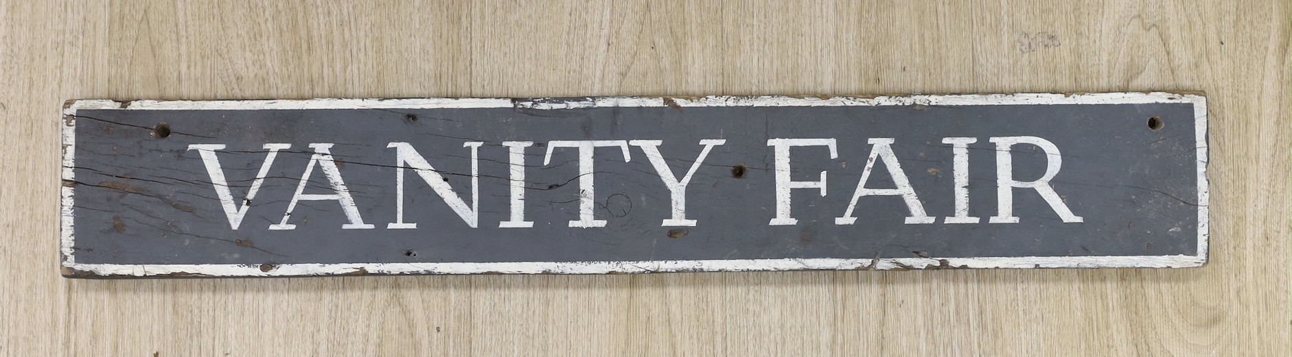 A painted 'Vanity Fair' sign 12.5x80cm